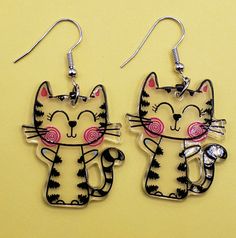 These earrings are so adorable. This cute cat is clear with black stipes and pink cheeks! These earrings are light weight and has the image on both sides. Striped Earrings, Pink Cheeks, So Adorable, Black Stripes, Cute Cat, Jewelry Earrings Dangle, Etsy Earrings, Dangle Drop Earrings, Dangle Earrings