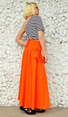 Extravagant orange skirt made of pure cotton, very light, colorful and playful. This flared long skirt is extremely comfortable and fun to wear, being a piece that will brighten up the streets and steal the spotlight! Material: 95% Cotton, 5% Elastane Care instructions: Wash at 30 degrees The model in the picture is size S. Can be made in ALL SIZES. If you have any other specific requirements, do not hesitate to contact me! I DO NOT CHARGE EXTRA MONEY for custom made items. All you need to do is Red Maxi Skirt With Pockets For Spring, Red Cotton Flared Skirt Bottoms, Red Cotton Midi Skirt, Summer Cotton Full Skirt Bottoms, Summer Full Skirt Cotton Bottoms, Summer Full Skirt Bottoms In Cotton, Red Cotton Maxi Skirt For Spring, Spring Red Cotton Maxi Skirt, Red Cotton Long Skirt