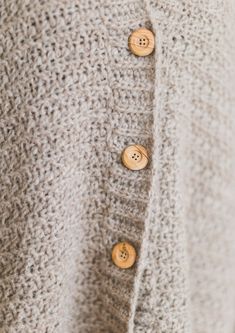 a close up of buttons on a sweater