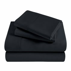 black sheets and pillowcases on a white background