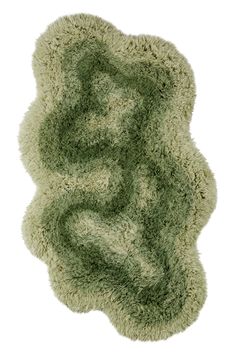 the rug is made out of shaggy green material