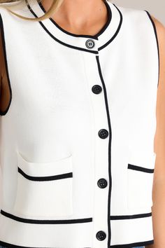 Set sail in style with our Smooth Sailing Ivory Sleeveless Button Front Vest! Made from quality materials. this vest will keep you comfortable and stylish all day long. The button front adds a touch of sophistication. while the sleeveless design is perfect for warmer weather. Upgrade your wardrobe today! This ivory vest features a crew neckline. a functional button front. functional pockets. high contrasting trim. and a slightly cropped hemline.  65% Viscose. 35% Nylon Unlined Hand Wash Cold Manufactured in China Designed in the USA Model is wearing a size small Elegant Sleeveless Vest With Button Closure, Tailored Sleeveless Vest With Buttons, White Fitted Vest With Button Closure, V-neck Vest With Button Closure For Summer, Tailored Sleeveless Vest With Button Closure, Sorority Rush Dresses, Smooth Sailing, Cardigan Crop Top, Rush Dresses