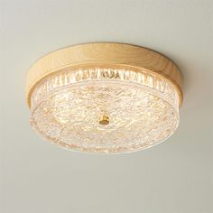 the light fixture is made from wood and has clear glass on it's sides