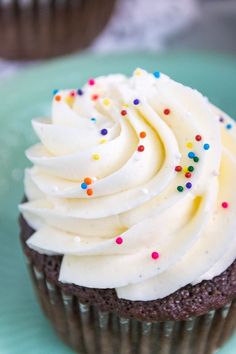 Close up of whipped vanilla buttercream on a cupcake with sprinkles. American Buttercream Frosting Recipe, American Buttercream Frosting, Whipped Buttercream Frosting, American Cupcakes, Whipped Buttercream, Dessert Squares, American Buttercream, Fluffy Frosting