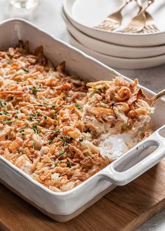 a casserole dish filled with chicken and rice