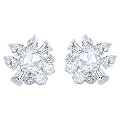 A brilliant cluster of colorless diamonds crafted meticulously to make these statement stud earrings. Studded with 4 round, 4 baguette, 4 pear, 6 rose cut round, 2 rose cut pear diamonds. All the diamonds are D-F color, IF-VS clarity, the total diamond weight of these 20 diamonds is 1 1/2 CT. It has a post back closure. These earrings are a part of our Cascade Collection which is inspired by the beauty of the naturally flowing waterfall. This piece will be accompanied by a HARAKH certificate of Luxury Rose Cut Diamond Cluster Earrings, White Diamond Jewelry, Statement Stud Earrings, Diamond Solitaire Earrings, Fancy Makeup, Gold Rings Fashion, Colorless Diamond, Diamond Stud Earrings, Pear Diamond