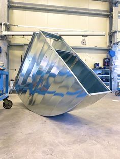 a large metal object sitting inside of a garage