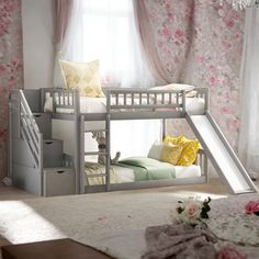 there is a bunk bed with a slide on it