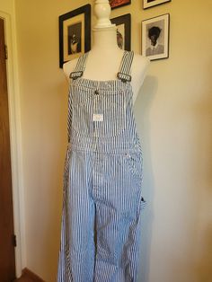 Vintage 1960's authentic Big Mac overalls are white with a vertical blue conductor stripe. Features several multi use pockets are on the front chest, button fly, two front waist pockets, two large back pockets, two pockets on the side of the right leg,  and hammer hook on the left leg. Adjustable overall straps. Union Made. 100% cotton. In excellent condition! These overalls have only slight light brown mark on the right overall strap (see picture). Priced for condition. Size Estimate M (waist 34") Overalls Costume, Overall Straps, Striped Overalls, Bib Overalls, Big Mac, Union Made, Bibs, Light Brown, Favorite Outfit