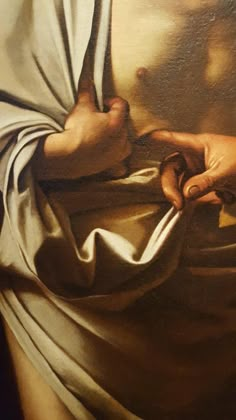 a close up of a painting of a person holding something in their hands and wearing a white cloth