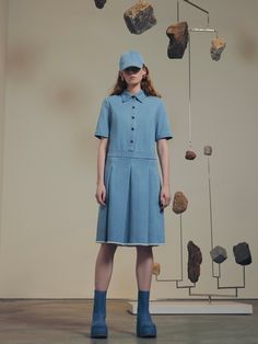 Building upon a successful series of polo-collared silhouettes, this Pre Fall 23 dress is crafted in the season’s garment-washed mid-weight denim. Designed with a relaxed fit, the drop waist silhouette gives way to wide box pleats and a frayed hem for a casual sensibility. Rosetta Getty's 10oz denim is mid-weight with a vintage feel. Offering season-spanning wear, the fabric features in styles that have been garment-washed for an inherent sense of ease. Spread collar Short sleeves Front button p Spring Collared Polo Dress For Daywear, Collared Polo Dress For Spring Daywear, Blue Short Sleeve Polo Dress For Spring, Spring Cotton Collared Polo Dress, Blue Casual Polo Dress For Summer, Casual Blue Polo Dress For Summer, Cotton Collared Polo Dress For Spring, Classic Blue Denim Dress For Work, Casual Spring Daywear Polo Dress