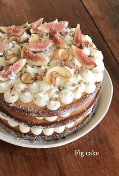 a cake with figs and nuts is on a plate