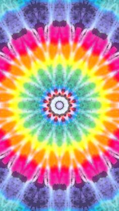 an image of a colorful tie - dyed background with a circular design in the middle