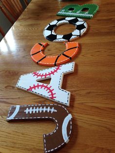 the table is covered with paper cutouts to spell out numbers for sports themed crafts