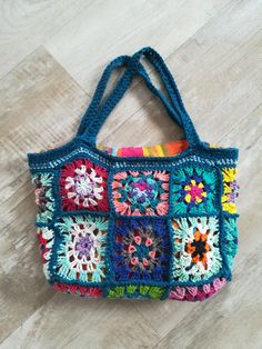 From small granny squares to small squares was born... A beautiful boho bag! Bohemian Granny Square Crochet Bag, Bohemian Granny Square Bag For Festival, Bohemian Festival Bag With Granny Square Details, Bohemian Granny Square Shoulder Bag For Daily Use, Handmade Rectangular Crochet Bag For Festival, Rectangular Crochet Shoulder Bag For Festival, Festival Rectangular Crochet Shoulder Bag, Bohemian Blue Shoulder Bag With Granny Square Details, Blue Bohemian Shoulder Bag With Granny Square Details