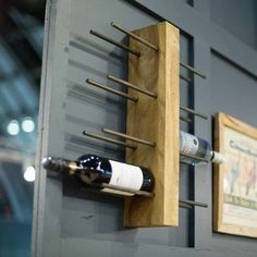 a wine rack is mounted on the wall