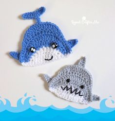 two crocheted shark and shark fin hats