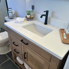 a bathroom with a sink and toilet in it