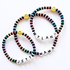 The CUTEST & HAPPIEST bracelet! Personalize with the name or initial of your choosing (or no name) and pair with the yellow smiley Made with 4mm black czech beads & 4mm rainbow heishi disc beads Personalized Black Beaded Bracelets, Fun Personalized Black Bracelets, Personalized Playful Beaded Bracelets, Personalized Fun Black Beaded Bracelets, Letter Beads Round Friendship Bracelet, Beaded Name Bracelet With Round Beads For Friendship, Friendship Beaded Name Bracelet, Fun Heishi Beaded Bracelets, Personalized Multicolor Friendship Bracelets With Round Beads