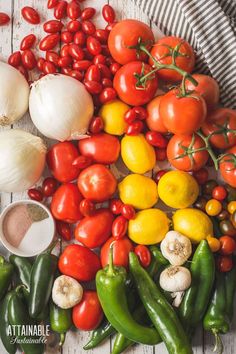 various types of tomatoes, peppers, and garlic on a table with the words canning salsa overlay