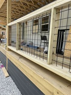 the inside of a house being constructed with wood and metal bars on the side of it