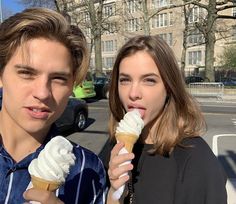 two people eating ice cream on the street