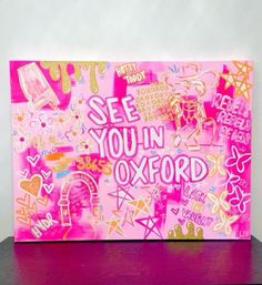 a pink greeting card with the words see you in oxford on it and lots of stickers