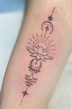 a black and white tattoo design on the arm