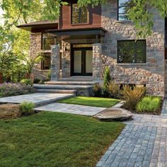 a house that is surrounded by grass and trees