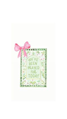 a greeting card with a pink bow on the front and green lettering that says you've been praying for today