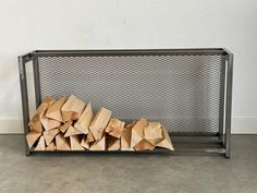 a pile of wood sitting on top of a metal shelf