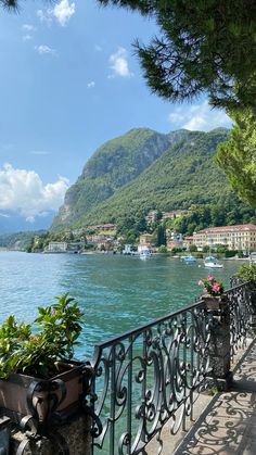 a balcony overlooks the water and mountains