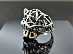 EXCLUSIVE DESIGN GEOMETRIC PANTHER RING PURE 925 STERLING SILVER RING This beautiful Panther Ring has been Fabulously casted with 925 Sterling Silver and has been designed with geometric shapes and patterns. The weight of the ring is 11-12 grams We have every size available, please inquire if you don't see your size available. We are a Los Angeles based company operating out of Thailand so that we may bring you the highest quality items at the most competitive prices, just search and compare, we Unique Silver Geometric Rings, Geometric Silver Ring As Gift, Silver Geometric Ring Gift, Silver Geometric Ring As Gift, Silver Geometric Rings As Gifts, Silver Geometric Ring For Gift, Geometric Sterling Silver Ring, Silver Geometric Sterling Silver Ring, Modern Geometric Sterling Silver Rings