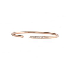 This 14K Gold bracelet offers an elevated look with its genuine diamond accents and spring action cuff closure. The 0.15ct diamond accents are set in a 14K gold band. Achieve a sophisticated, timeless style with this classic piece of fine jewelry. Classic Adjustable Diamond Cuff Bracelet, Classic Diamond Cuff Bracelet, Rose Gold Diamond Cuff Bracelet With Diamond Accents, Minimalist Diamond Cuff Bracelet For Anniversary, Rose Gold Diamond Cuff Bracelet With Accents, Modern Rose Gold Bangle With Diamond Accents, Minimalist Formal Diamond Cuff Bracelet, Modern Rose Gold Diamond Bracelet With Single Cut Diamonds, Elegant Stackable Open Band Bracelets