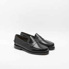 Black brushed leather unlined penny loafer, 4 season, black rubber heel and leather sole. Classic Black Loafers With Leather Footbed, Classic Black Loafers With Stitched Sole, Classic Black Tassel Loafers With Leather Lining, Classic Black Semi-formal Loafers, Classic Moccasins With Stitched Sole, Black Loafers With Goodyear Welt Construction, Classic Black Wingtip Loafers, Black Semi-formal Goodyear Welted Moccasins, Classic Black Moccasins For Business