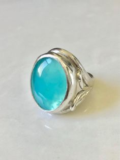 One of the best Peruvian opal pieces I set. Vivid color in this sterling silver ring. Silver Opal Cabochon Ring In Fine Jewelry Style, Elegant Turquoise Moonstone Ring In Sterling Silver, Sterling Silver Oval Cabochon Opal Ring, Sterling Silver Opal Cabochon Ring, Formal Sterling Silver Opal Cabochon Ring, Elegant Sterling Silver Opal Ring With Large Stone, Elegant Turquoise Opal Ring In Sterling Silver, Peruvian Opal, Opal Rings