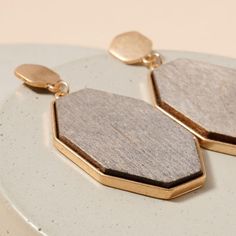 Wooden geometric shaped dangling earrings with metal stud.Approx: 2.25"Material: Zinc, BrassGold plated, woodLead Compliant, Nickle Free Royal Closet, Best Earrings, Brass Gold, Dangling Earrings, Silver Earrings, Cufflinks, Dangle Earrings, Gold Plate, Plating