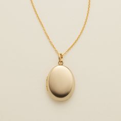 Oval Locket Necklace Cheap Gold Locket Jewelry, Luxury Minimalist Locket Jewelry, Cheap Adjustable Gold Locket Necklace, Oval Locket Necklace For Anniversary, Cheap Gold Engraved Locket Necklace, Cheap Gold Oval Necklace, Affordable Elegant Locket Necklace, Keepsake Necklace Lockets, Cheap Round Pendant Locket Jewelry