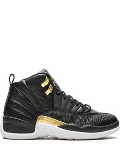 Supplied by a premier sneaker marketplace dealing with unworn, already sold out, in demand rarities. Each product is rigorously inspected by experienced experts guaranteeing authenticity. The Air Jordan 12 Retro "Snakeskin" is treating women to an outstanding lifestyle sneaker. Souped up with style, the pair creates a premium colorway with the slick combination of black and metallic gold. The offering brings a variety of textures as some areas are covered in smooth leather and others display different snakeskin patterns. The luxe Air Jordan 12 is rounded out with metallic gold lacelets and a matching midfoot plate, as well as a white outsole finish. Jordan Wmns, Michael Jordan Shoes, Air Jordan 12, Black Jordans, Air Jordan 12 Retro, Jordan Air, Jordan 12 Retro, Jordan 12, Jordans 12