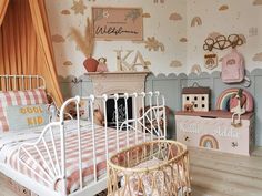 a child's bedroom decorated in pastel colors