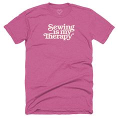 a pink t - shirt with the words sewing is my therapy printed in white on it