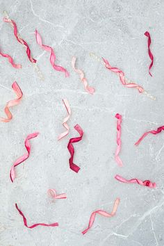 streamers of pink and red ribbons on the ice