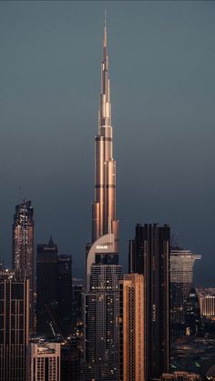 a very tall building towering over a city