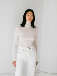 ESTELLA | Agyness Turtleneck in Winter White Elegant Spring Turtleneck For Layering, Versatile Fine Knit Turtleneck Sweater, Chic High Neck Fine Knit Turtleneck, Elegant Fine Knit Turtleneck For Spring, Elegant Fine Knit Turtleneck For Layering, Chic Fine Knit High Neck Turtleneck, Cream Cashmere Turtleneck Top, Cashmere Turtleneck For Layering, Chic Beige Turtleneck For Layering