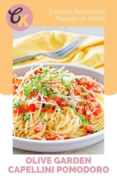 a plate of spaghetti with tomatoes and parmesan cheese