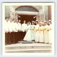 a group of people standing on steps in front of a building wearing white dresses and holding bouquets