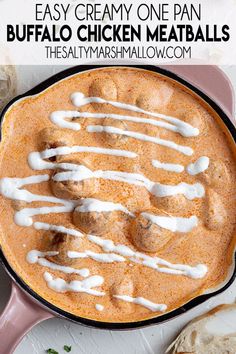 an easy creamy one pan buffalo chicken meatballs in a cast iron skillet