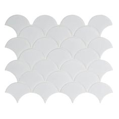 white scallop tile on a white background with an oval pattern in the center