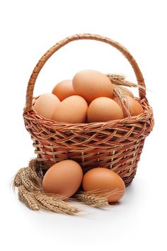 several eggs in a wicker basket on a white background stock photo - 717982