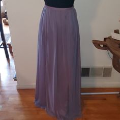 This Beautiful Breath Taking Light Purple Maxi Skirt Has Never Been Worn It Still Has Tags Attached. It Sells Its Self It Beautiful Breathable Lightweight Fun Chic And Sexy All In One Elegant Purple Pleated Maxi Skirt, Elegant Full Skirt In Purple, Elegant Purple Full Skirt Bottoms, Elegant Full Purple Skirt, Elegant Purple Relaxed Maxi Skirt, Purple Elegant Relaxed Fit Maxi Skirt, Elegant Fitted Lavender Skirt, Elegant Lavender Skirt For Party, Elegant Purple Skirt